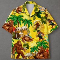 A short-sleeve button-up Hawaiian shirt with a bright yellow background and an all-over cartoon print featuring Bigfoot in tropical beer-themed scenes, including palm trees, beer mugs, hops, and surfboards, shown on a gray background.