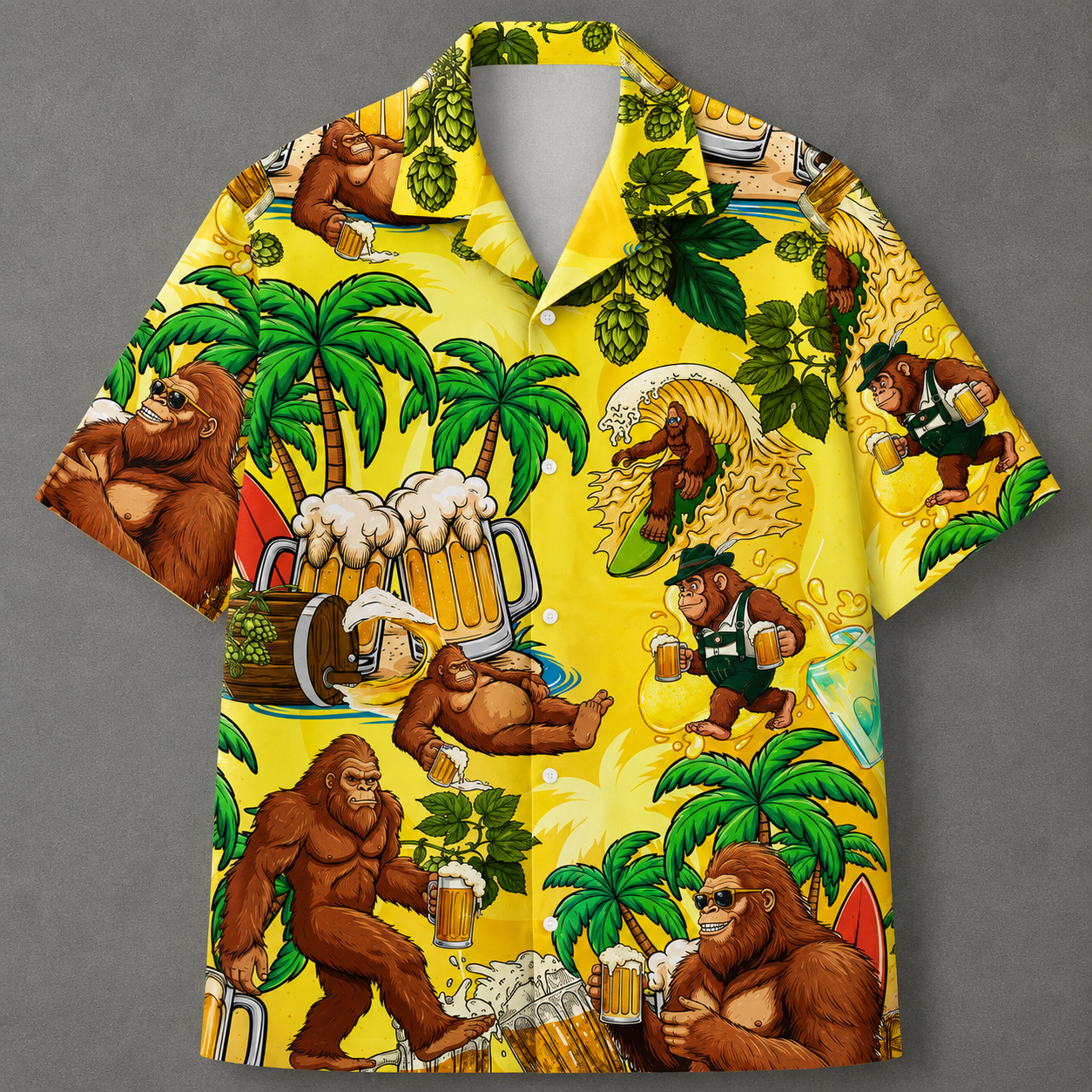 A short-sleeve button-up Hawaiian shirt with a bright yellow background and an all-over cartoon print featuring Bigfoot in tropical beer-themed scenes, including palm trees, beer mugs, hops, and surfboards, shown on a gray background.