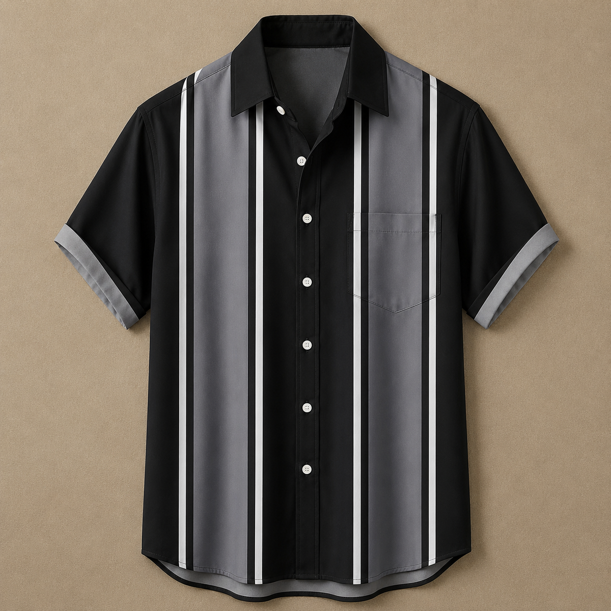 A short-sleeve button-up shirt with a black base and vertical gray and white stripes, displayed flat against a textured tan background.