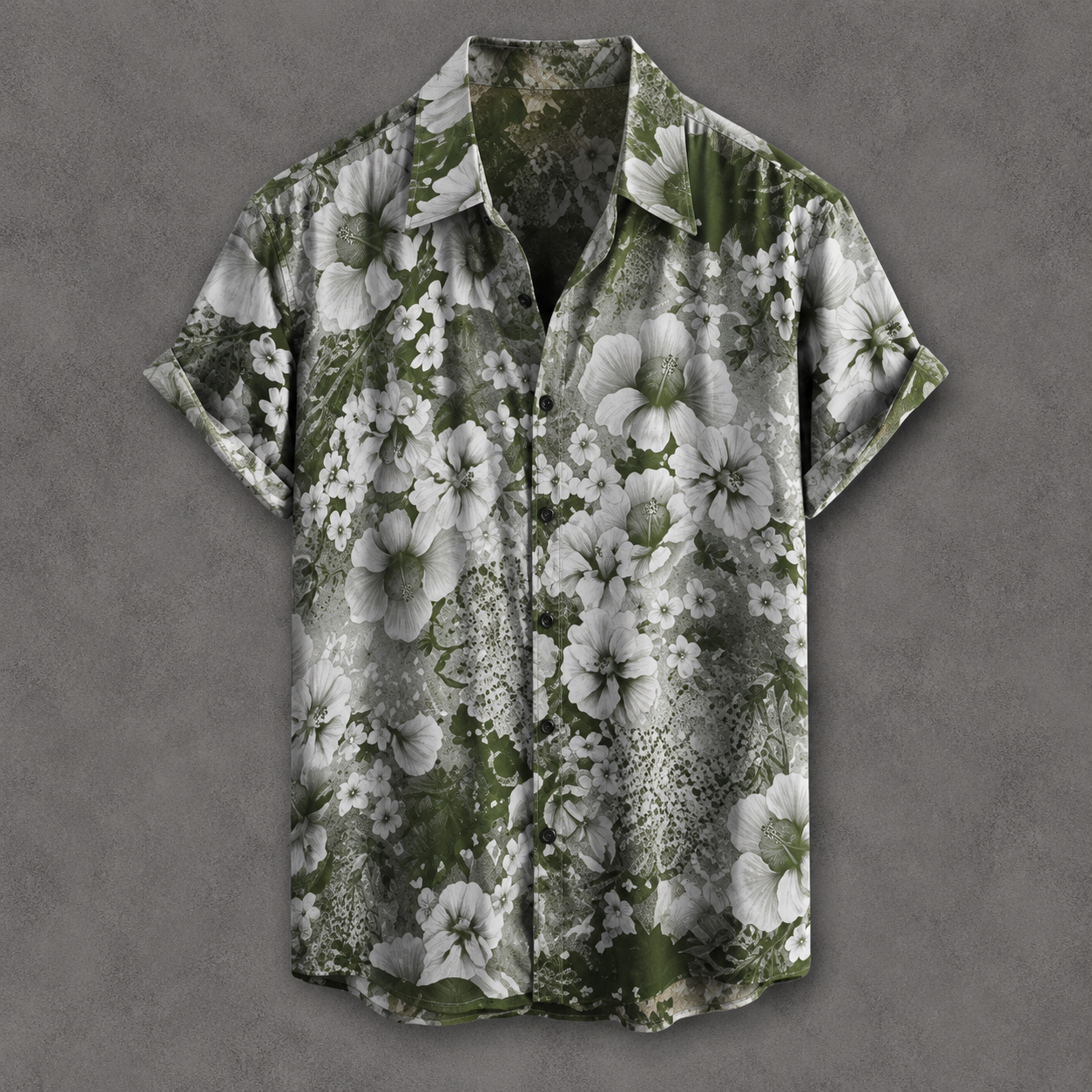 A short-sleeve button-up camp shirt with a green and white floral print, displayed flat against a textured gray background.