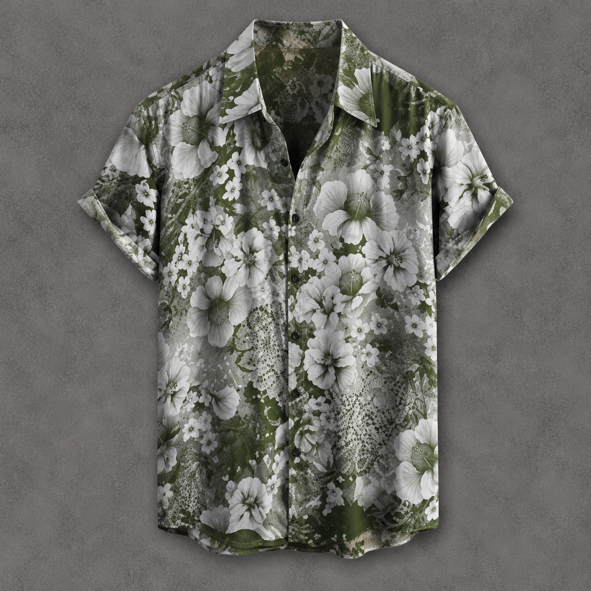 A short-sleeve button-up camp shirt with a green and white floral print, displayed flat against a textured gray background.