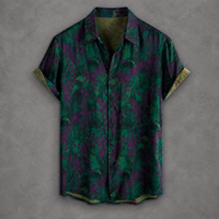 A short-sleeve button-up shirt with a green and purple abstract floral pattern, displayed flat against a textured gray background.
