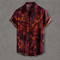 A short-sleeve button-up shirt with an abstract floral pattern in deep burgundy, maroon, and orange, displayed flat against a textured gray background.