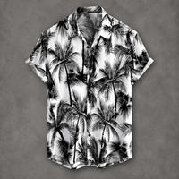 A short-sleeve button-up camp shirt with a black and white palm tree print, displayed flat against a textured gray background.