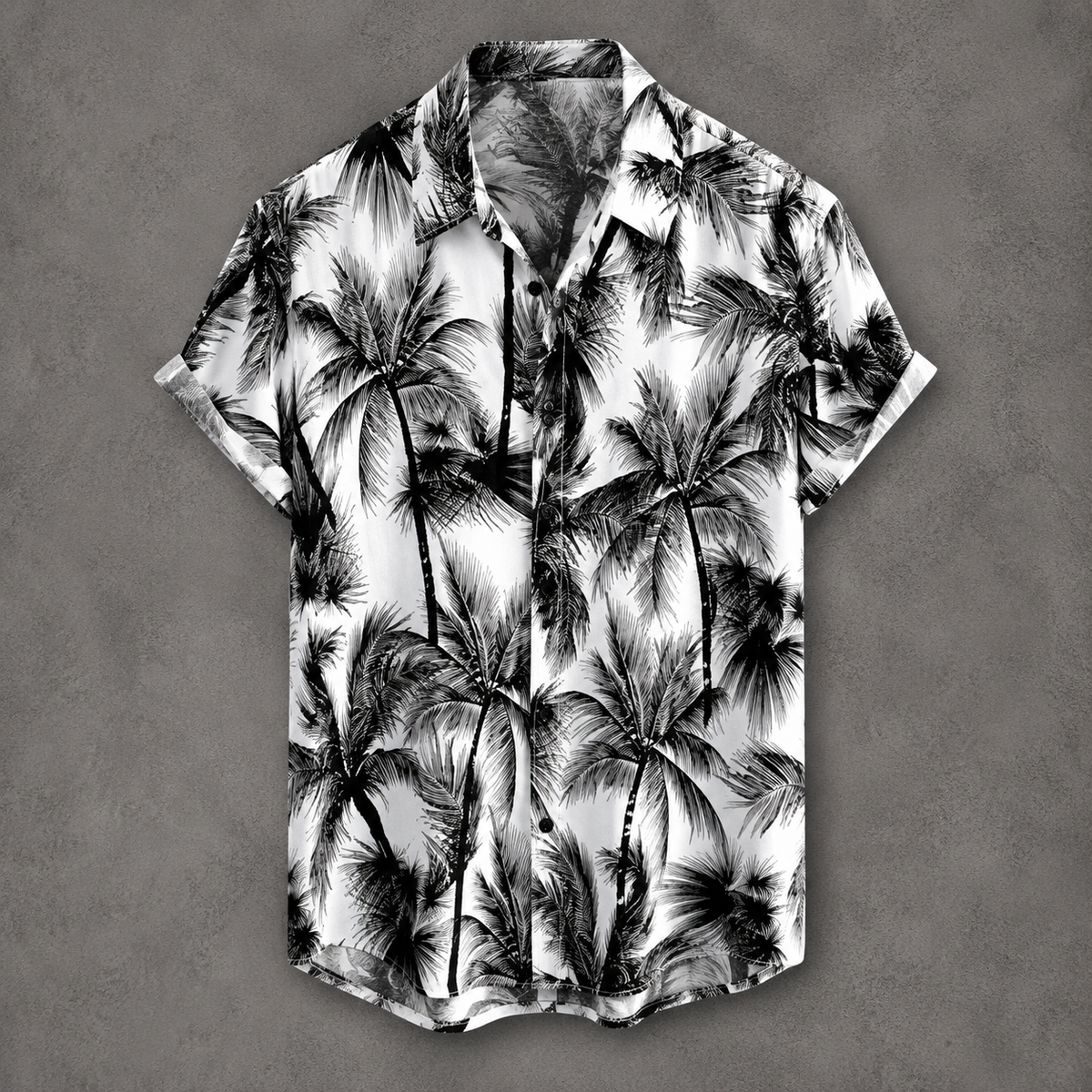 A short-sleeve button-up camp shirt with a black and white palm tree print, displayed flat against a textured gray background.