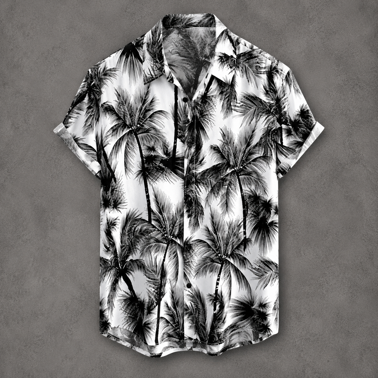 A short-sleeve button-up camp shirt with a black and white palm tree print, displayed flat against a textured gray background.
