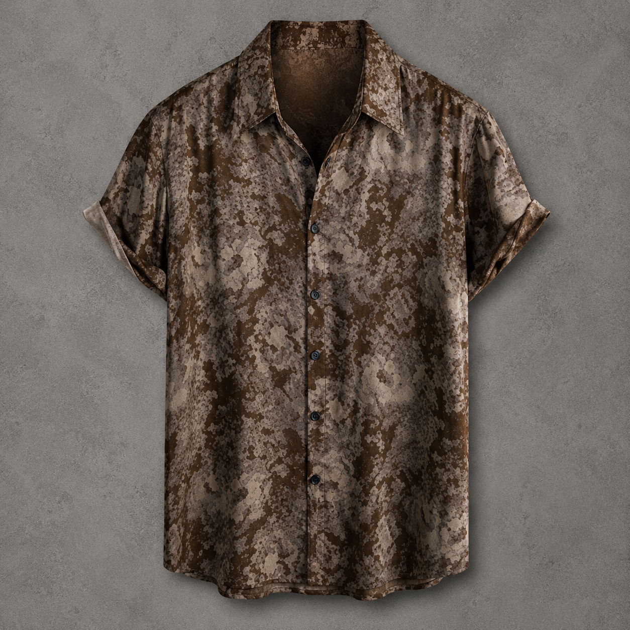 A short-sleeve button-up shirt with a brown and beige distressed, textured pattern, displayed against a textured gray background.
