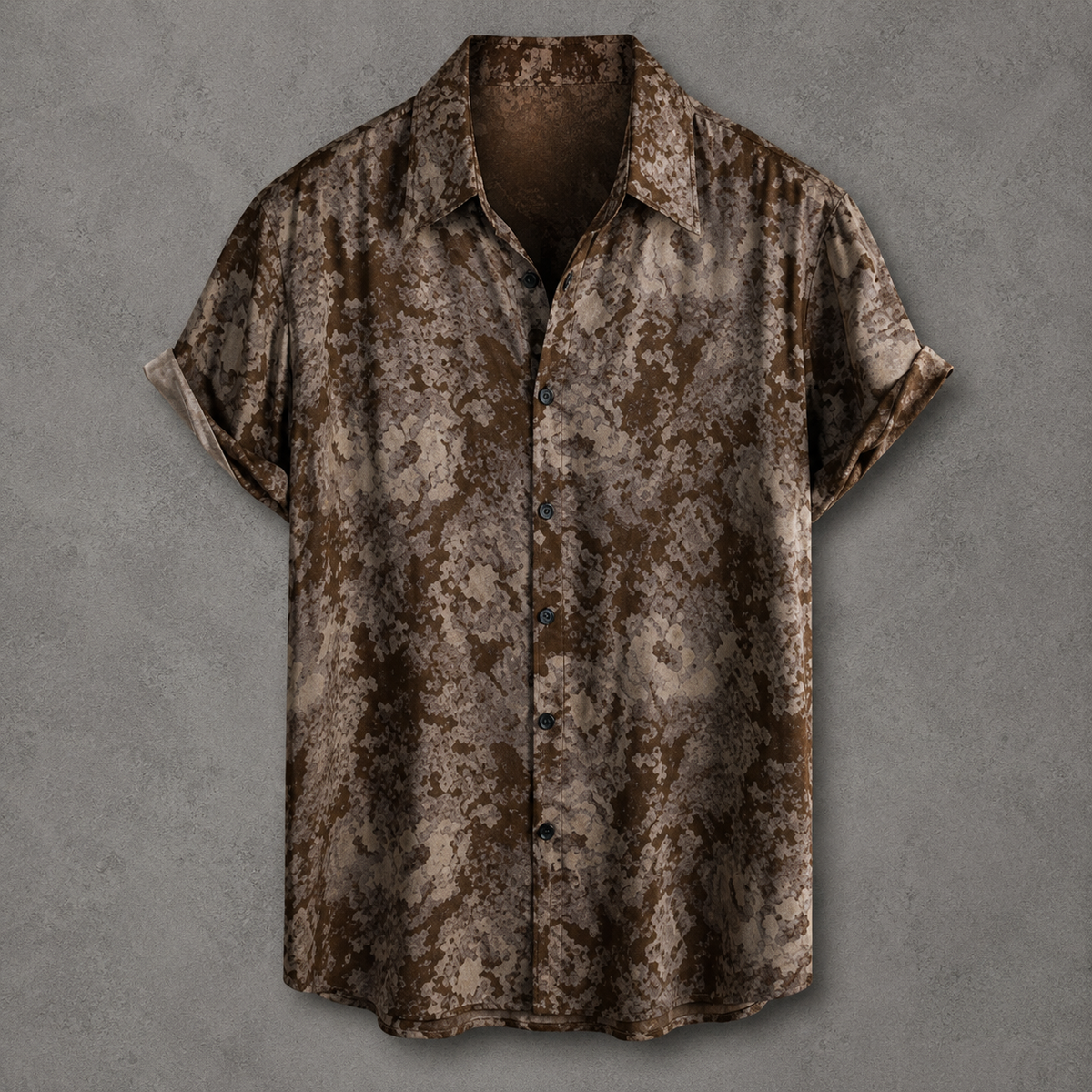 A short-sleeve button-up shirt with a brown and beige distressed, textured pattern, displayed against a textured gray background.