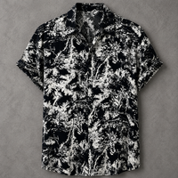 A short-sleeve button-up camp shirt with a black and white abstract leafy pattern, laid flat on a textured gray background.