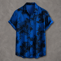 A short-sleeve button-up shirt in vibrant royal blue with a black tropical floral and branch print, displayed flat against a textured gray background.