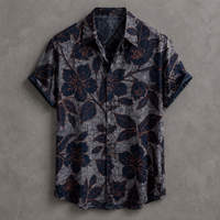 A short-sleeve button-up shirt with a dark navy blue floral pattern over a textured gray background, laid flat on a gray textured surface.