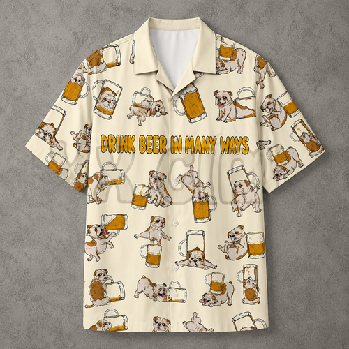 A short-sleeve button-up camp shirt with a cream background, featuring a repeating pattern of bulldog illustrations holding beer mugs and the text 'DRINK BEER IN MANY WAYS' across the chest. The shirt is displayed flat against a textured gray background.