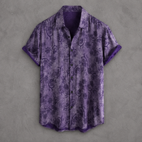 A short-sleeve button-up shirt in purple with a dark paisley pattern and solid purple trim, displayed flat against a textured gray background.