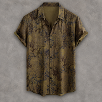 A short-sleeve button-up shirt with a muted olive-brown base and an allover abstract floral or branch-like print in dark blue and black, displayed against a textured gray background.