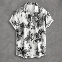 A short-sleeve button-up shirt with a black and white floral and branch print, displayed flat against a textured gray background.