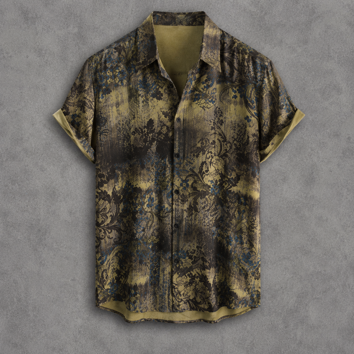 A short-sleeve button-up shirt with a dark brown and olive green abstract floral pattern, displayed flat against a textured gray background.
