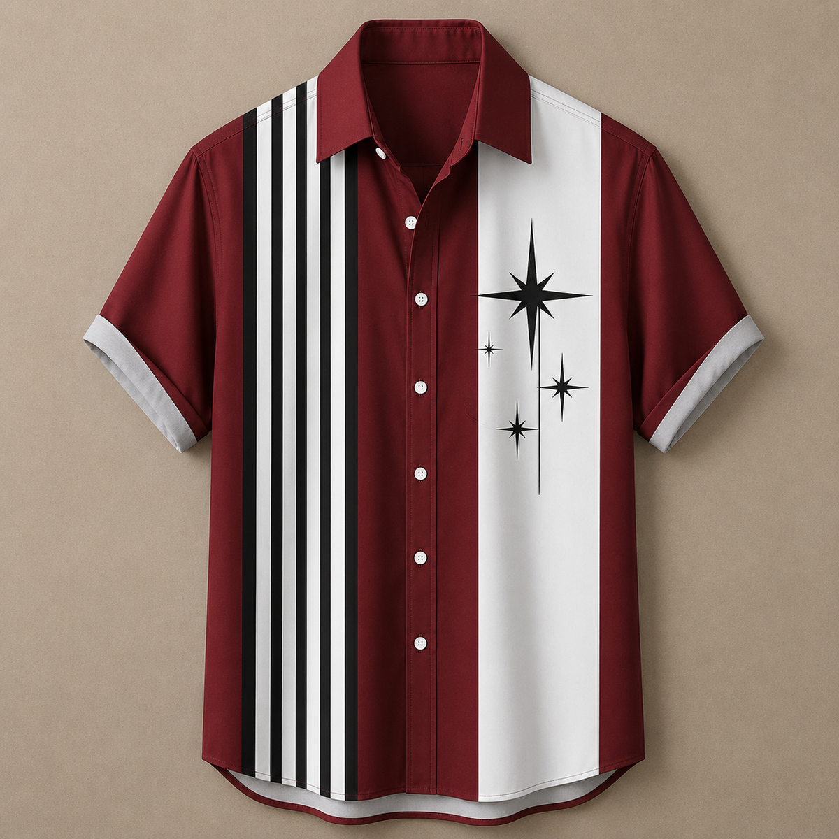 A short-sleeve button-up shirt with a bold graphic design, featuring a deep red body with a vertical white stripe on the right side decorated with black starburst graphics, and a vertical white stripe on the left side with black and white stripes. The shirt is displayed flat against a solid beige background.