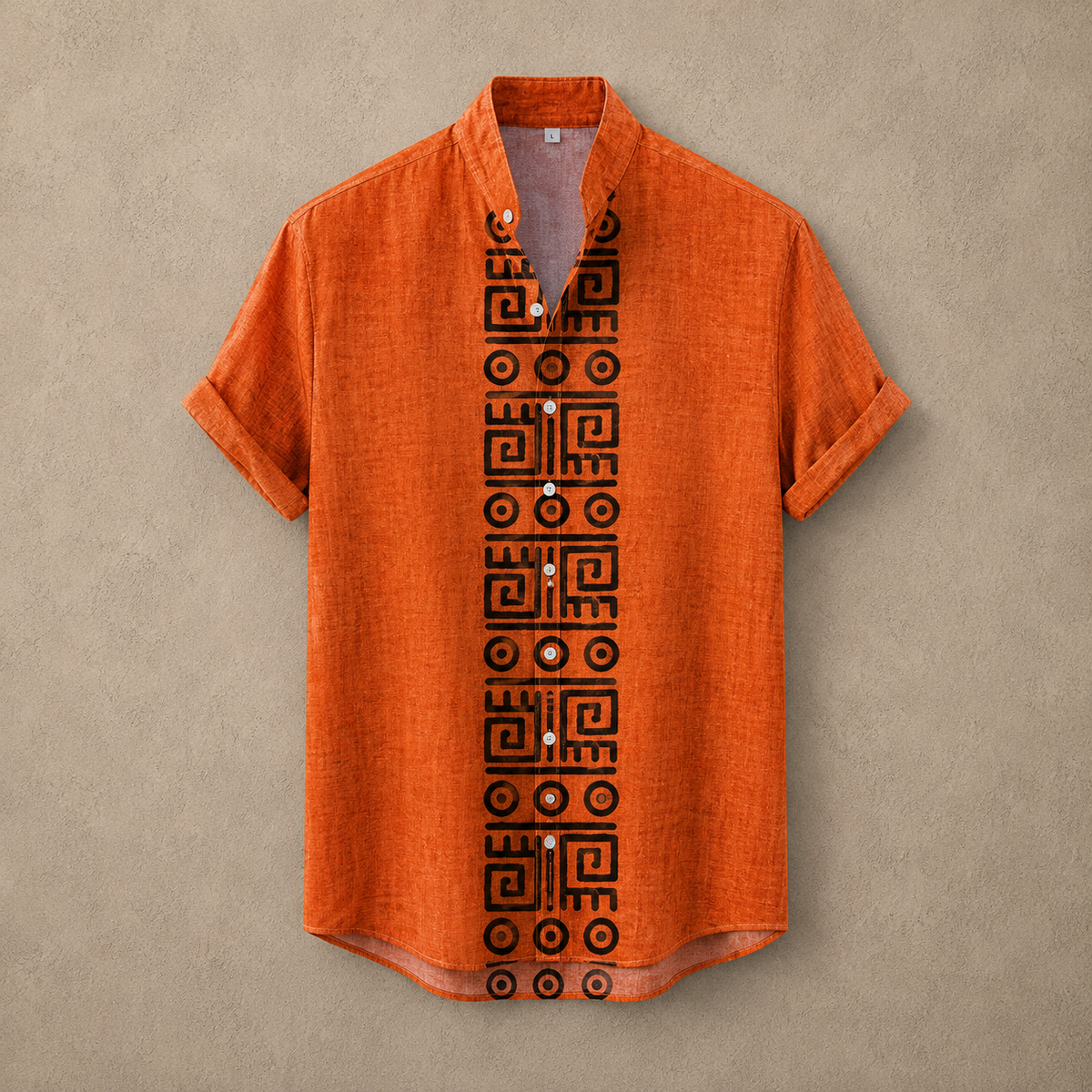 An orange short-sleeve linen shirt with a black geometric pattern down the center front, displayed flat against a textured beige background.
