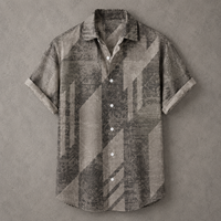 A short-sleeve button-up shirt with a distressed geometric pattern in shades of gray, brown, and beige, laid flat on a textured gray background.