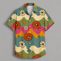 A short-sleeve button-up shirt with a retro 70s floral pattern, featuring wavy stripes of olive green, cream, pink, and mustard yellow, decorated with orange, white, and blue flowers, shown flat on a gray background.