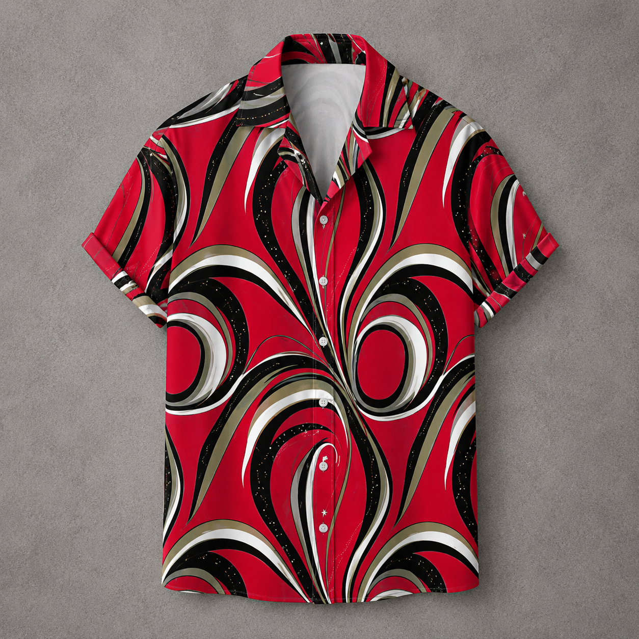 A short-sleeve button-up camp shirt with a bold retro swirl pattern in red, black, white, and beige, laid flat on a textured gray background.