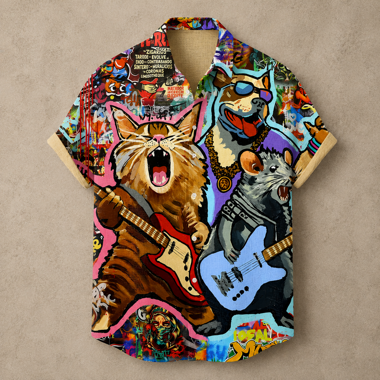 A short-sleeve button-up shirt with a highly colorful, detailed graphic print featuring a roaring orange tabby cat playing a red electric guitar and a gray mouse playing a light blue electric guitar, set against a collage-style background of posters, graffiti, and abstract art.
