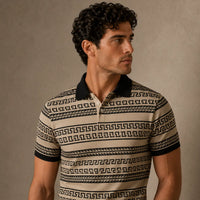 Man wearing a patterned polo shirt against a neutral background