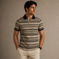 Man wearing a patterned polo shirt against a beige background