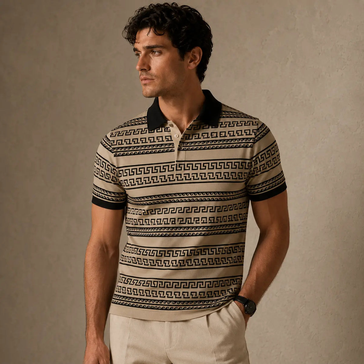Man wearing a patterned polo shirt against a beige background