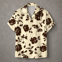 A short-sleeve camp collar button-up shirt with a dark brown floral print on a cream background, displayed flat against a textured gray backdrop.