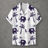 A white short-sleeve camp collar button-up shirt with a dark purple tropical print featuring elephants, palm trees, and cocktail glasses, displayed flat against a textured gray background.