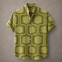 A short-sleeve button-up shirt with a textured olive green and dark olive geometric pattern, displayed flat against a textured gray background.