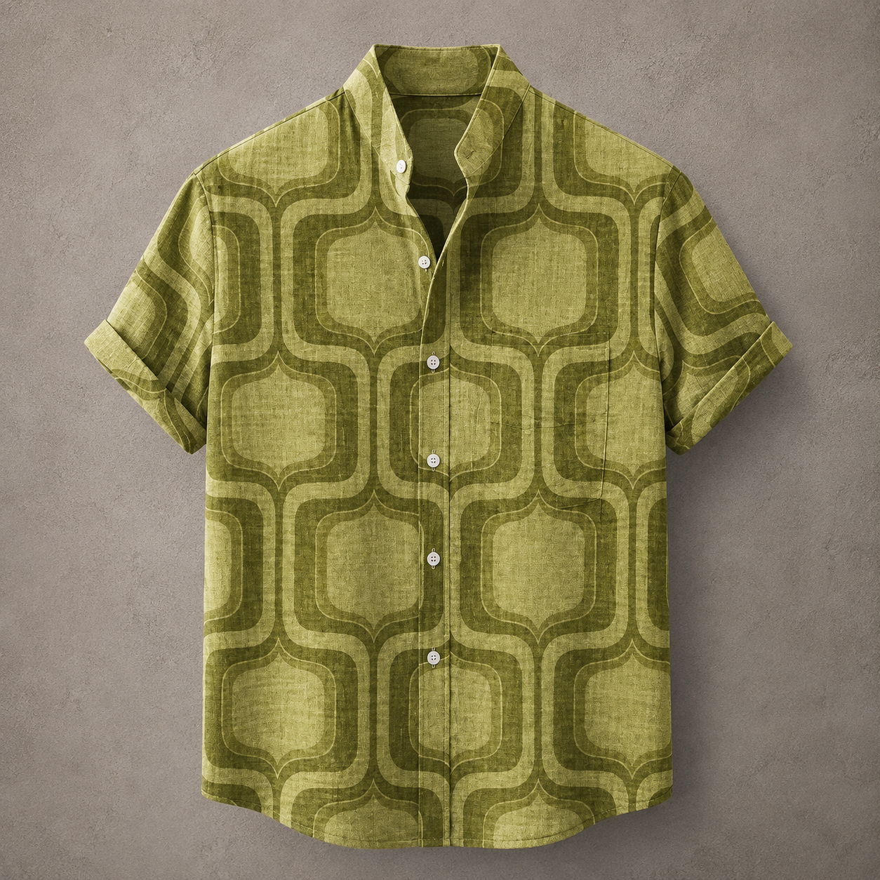 A short-sleeve button-up shirt with a textured olive green and dark olive geometric pattern, displayed flat against a textured gray background.