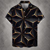 A short-sleeve button-up camp shirt with a black and dark gray geometric faceted pattern outlined in metallic gold, displayed against a textured gray background.