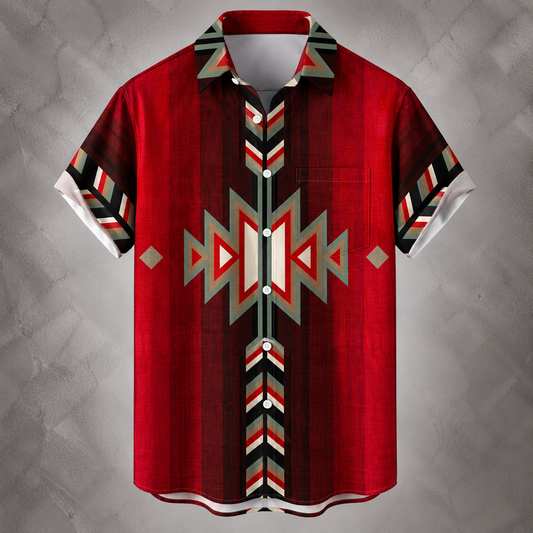 A short-sleeve button-up shirt with a bold Southwestern geometric pattern in red, black, white, and gray, displayed against a textured gray background.