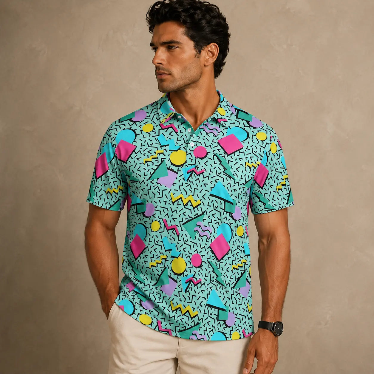 Man wearing a colorful patterned shirt against a beige background