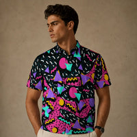 Man wearing a colorful geometric patterned shirt against a beige background