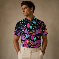 Man wearing a colorful geometric patterned shirt against a beige background