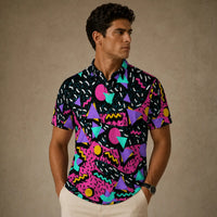 Man wearing a colorful geometric patterned shirt against a beige background