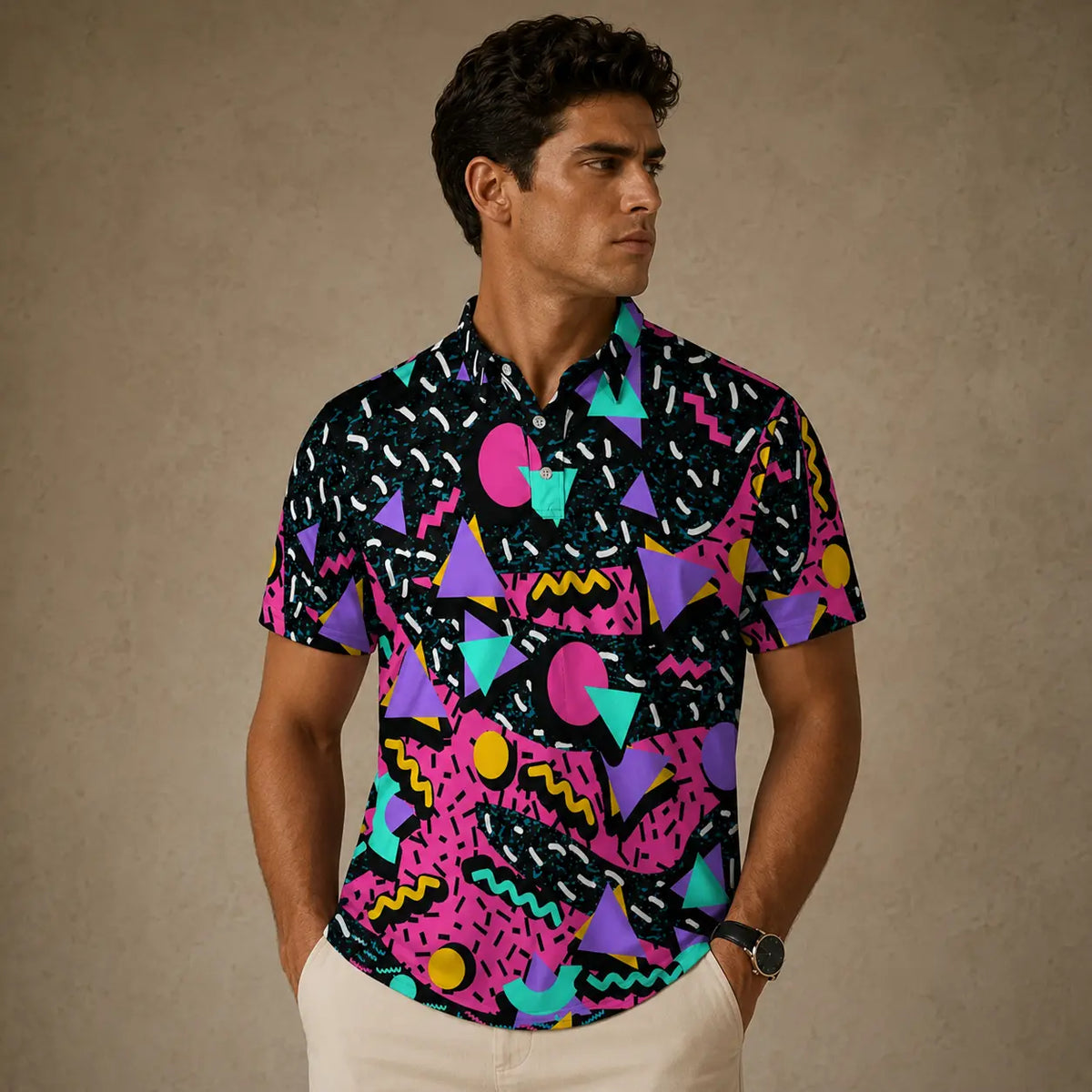 Man wearing a colorful geometric patterned shirt against a beige background