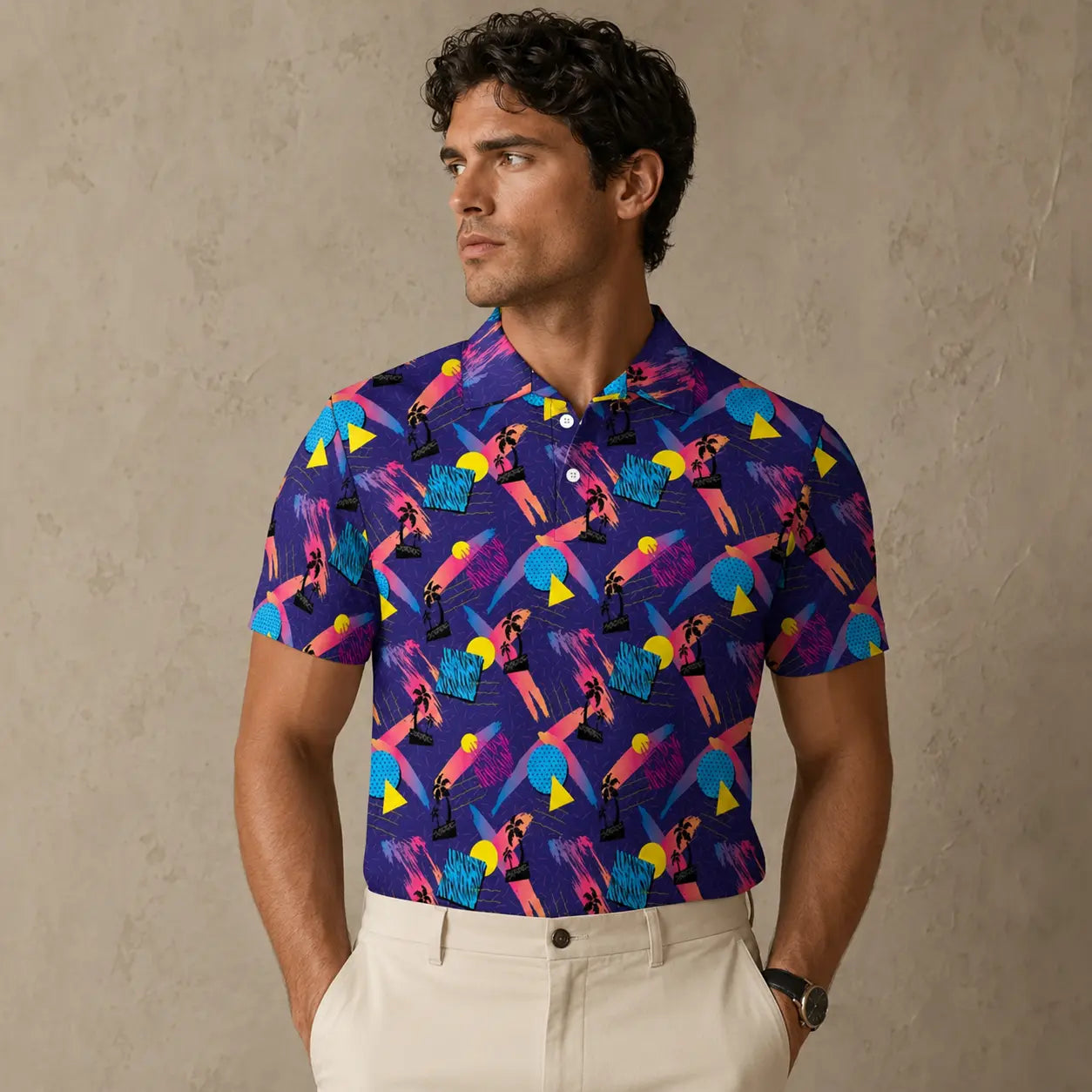 Man wearing a colorful patterned shirt against a beige background
