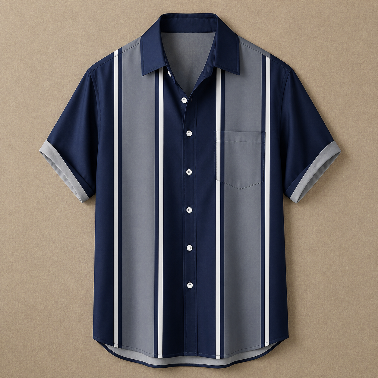 A short-sleeve button-up shirt with vertical stripes in navy blue, medium gray, and white, laid flat against a textured beige background.