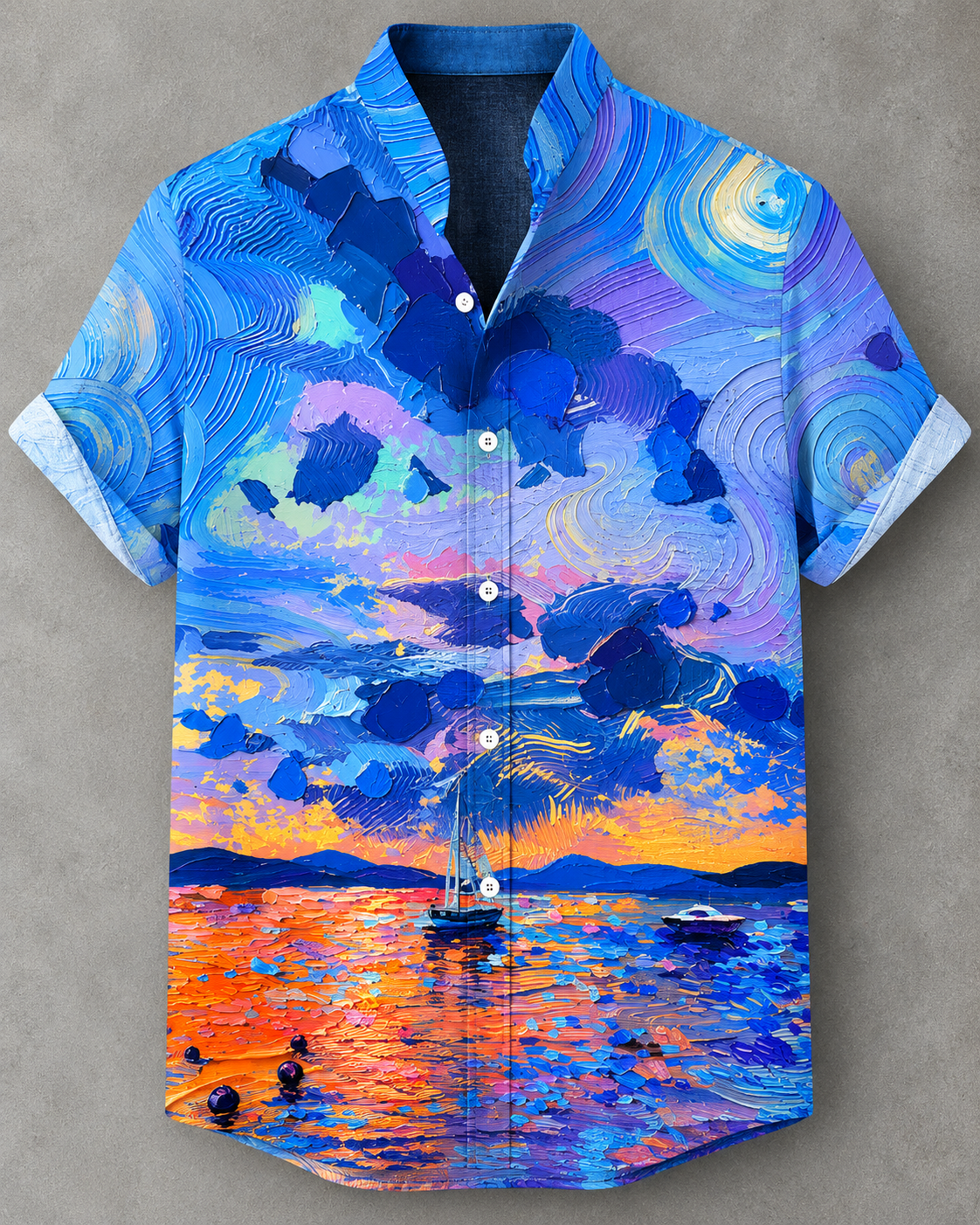 A short-sleeve button-up camp shirt featuring a vibrant, impressionistic painting of a sunset seascape with a sailboat, printed on a gray background.