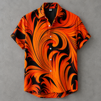 A short-sleeve button-up shirt with a bold orange and black abstract swirl pattern, displayed flat against a textured gray background.