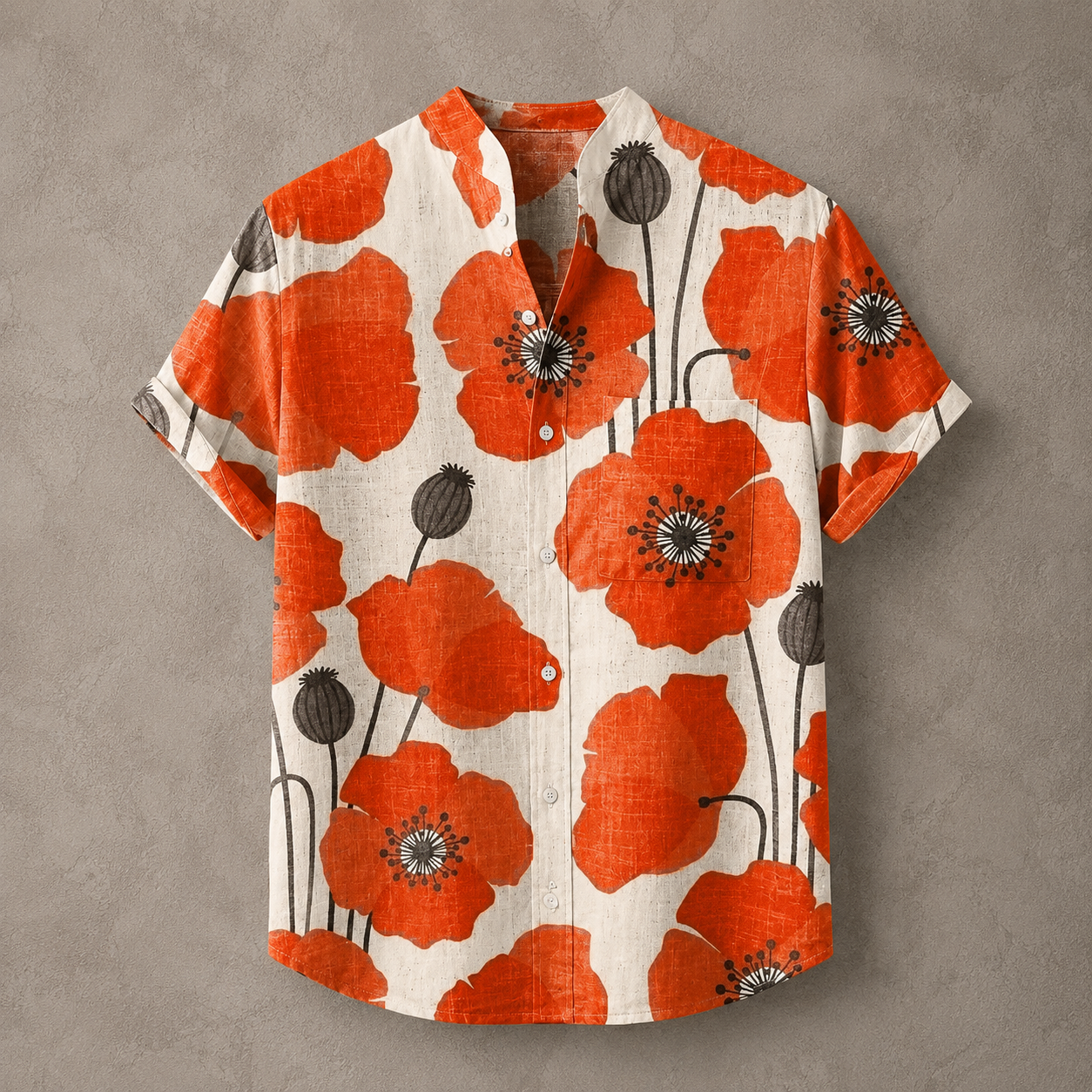 A short-sleeve button-up shirt with a vibrant orange poppy floral print on a textured cream linen background, displayed flat against a neutral gray wall.