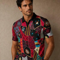 Man wearing a colorful patterned shirt against a beige background