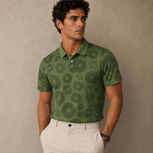 Man wearing a green patterned polo shirt against a beige background