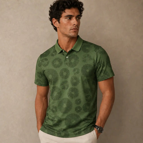 Man wearing a green patterned polo shirt against a beige background