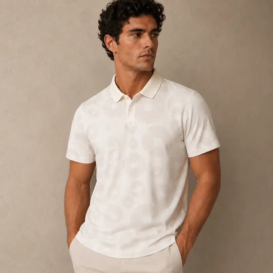 Man wearing a white polo shirt against a beige background