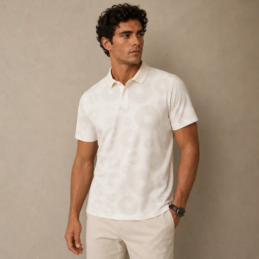Man wearing a white polo shirt against a beige background